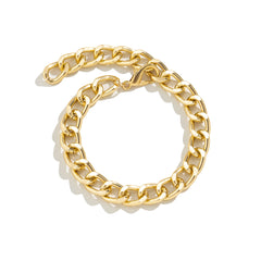 Elegant 18K gold-plated curb chain bracelet emphasizes its rich color and stylish design.