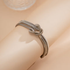 Silver-Plated Herringbone Chain Knot Bracelet