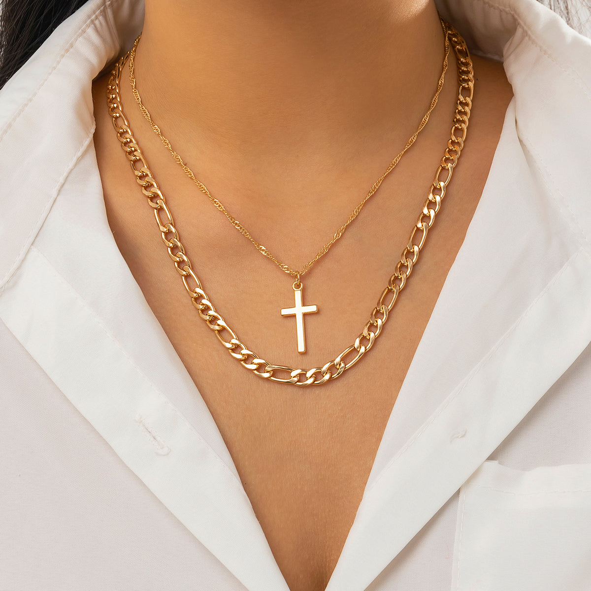 Elegant 18K gold-plated necklace featuring a cross pendant, perfect for adding a touch of faith to any outfit.