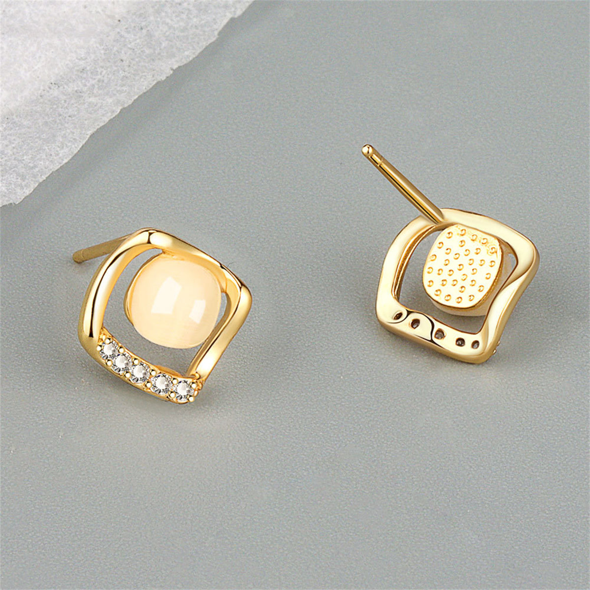  Chic 18K gold-plated earrings with white stones, featuring a unique rhombus design that adds sophistication to any outfit.