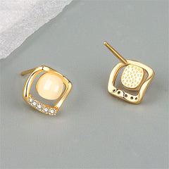  Chic 18K gold-plated earrings with white stones, featuring a unique rhombus design that adds sophistication to any outfit.