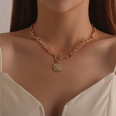 Chic gold chain necklace with a unique coin pendant, a stylish accessory that enhances any look effortlessly.