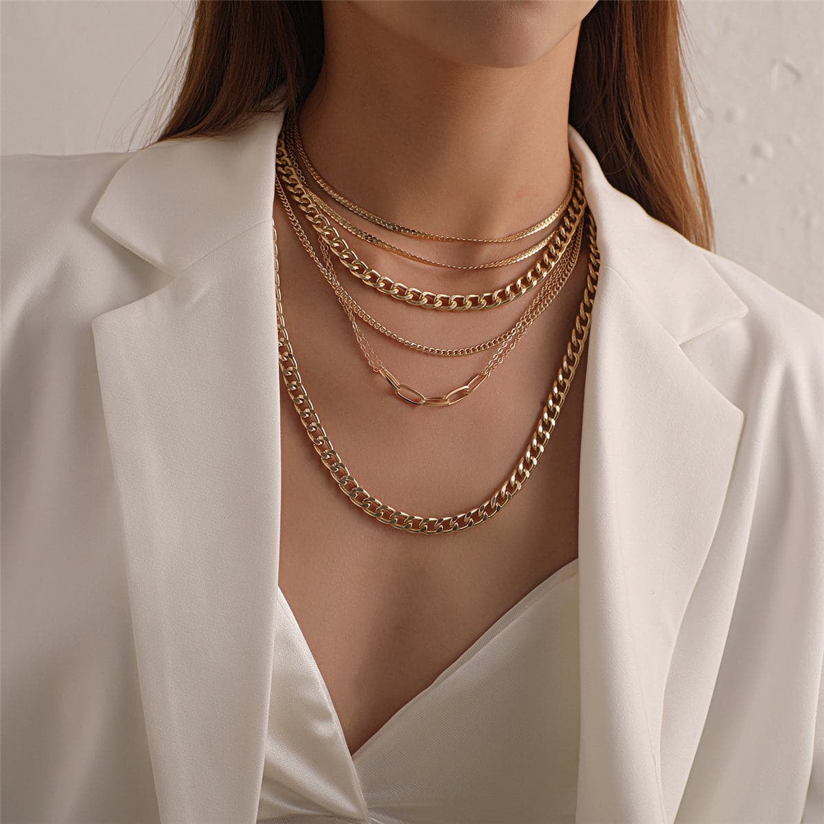 Elegant 18K gold-plated Cuban chain necklace, featuring multiple layers for a stunning, sophisticated look.