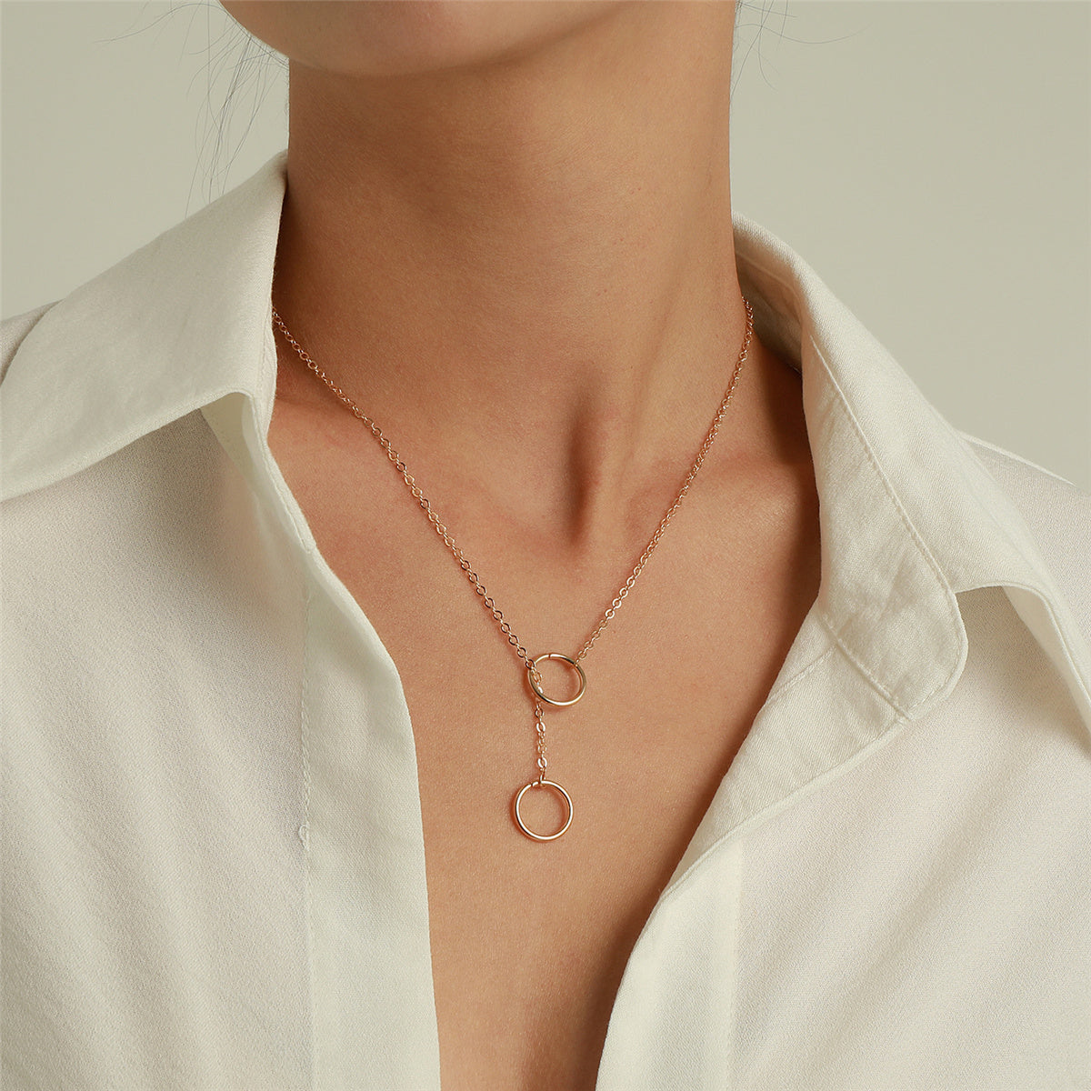 Stunning rose gold necklace with dual circles, crafted in 18K gold plating, ideal for adding a touch of elegance.